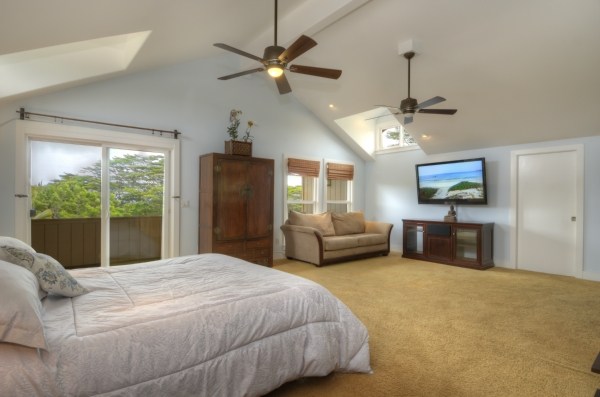 5693 F Kaapuni Road, Unit 2 Kapaa, HI 96746 - Photo 19 of 25 a bed room with a bed window and a flat screen tv