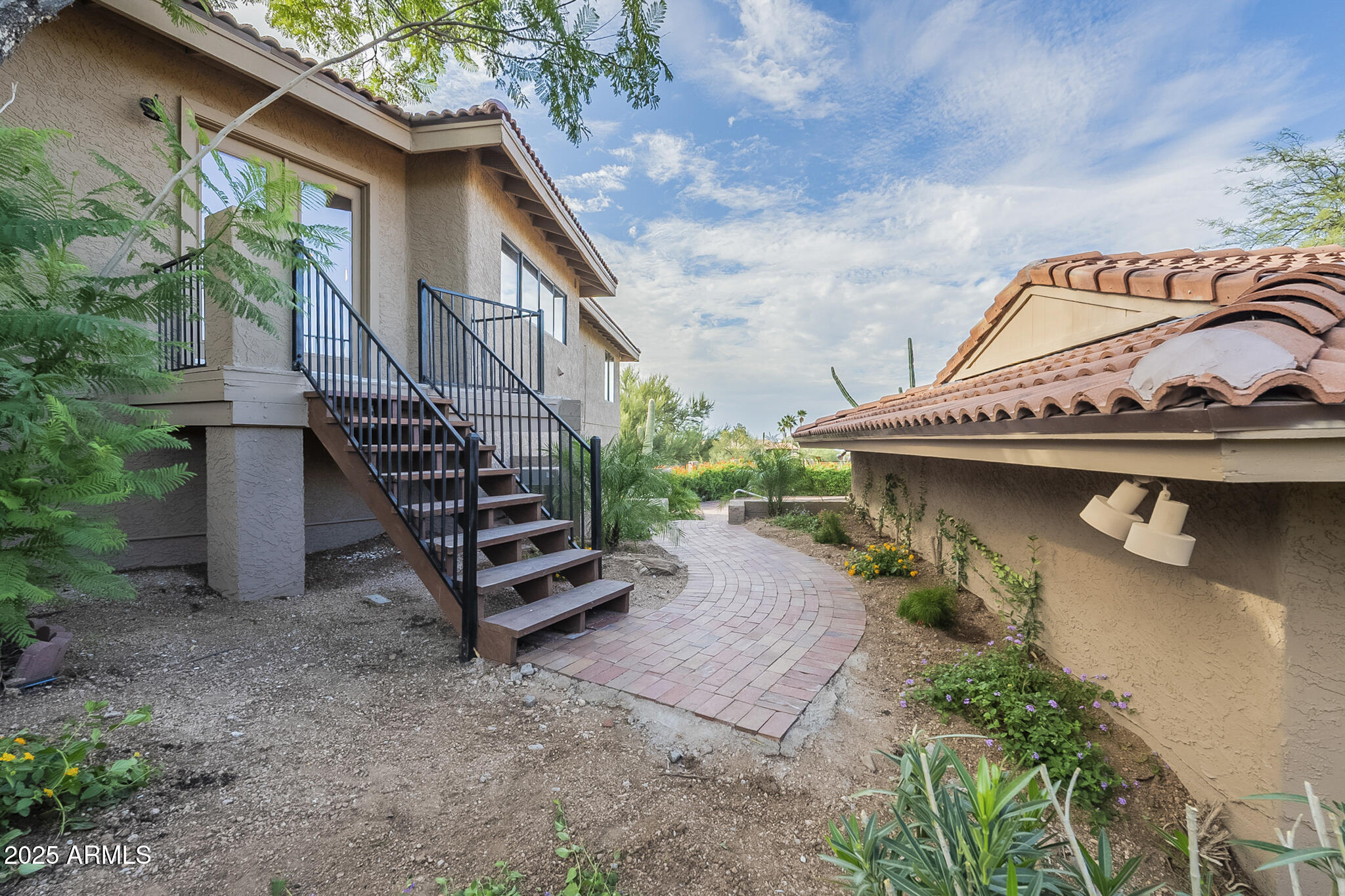 36618 Wild Flower Road Carefree, AZ 85377 - Photo 41 of 60 STAIRS OUT OF KITCHEN TO POOL AREA