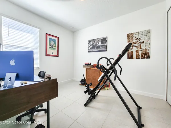 a bedroom with furniture and window