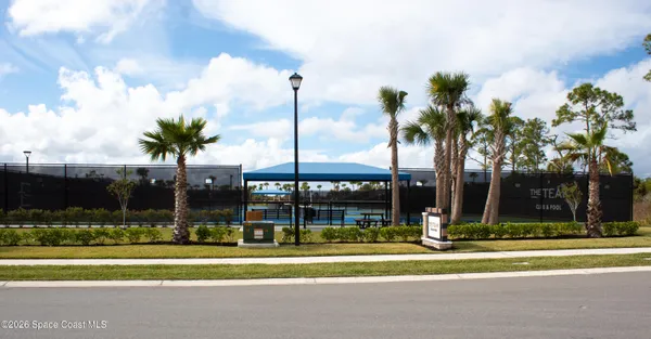 a view of an outdoor space and tennis court