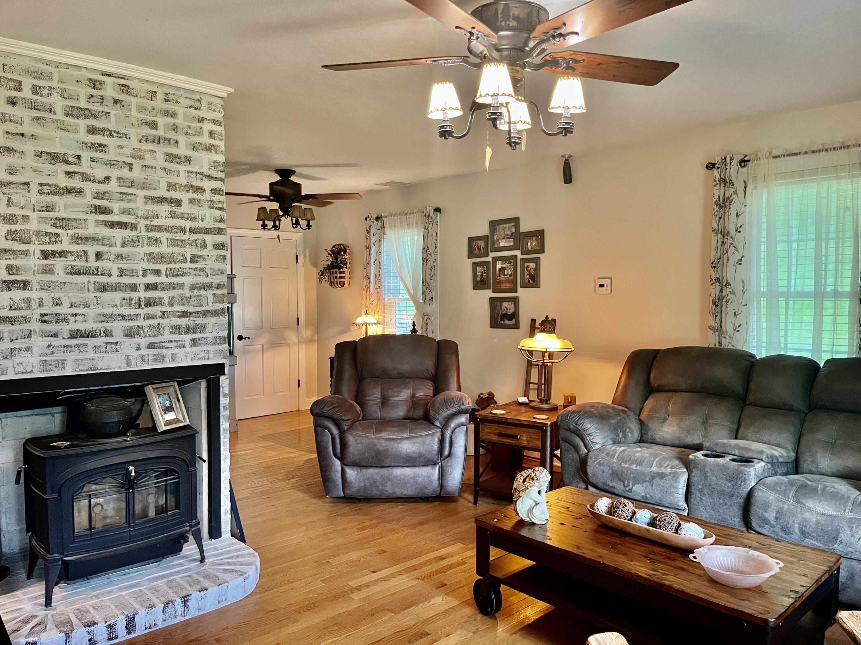 1195 Jr Road Franklin Furnace, OH 45629 - Photo 4 of 59 Living room with original fireplace