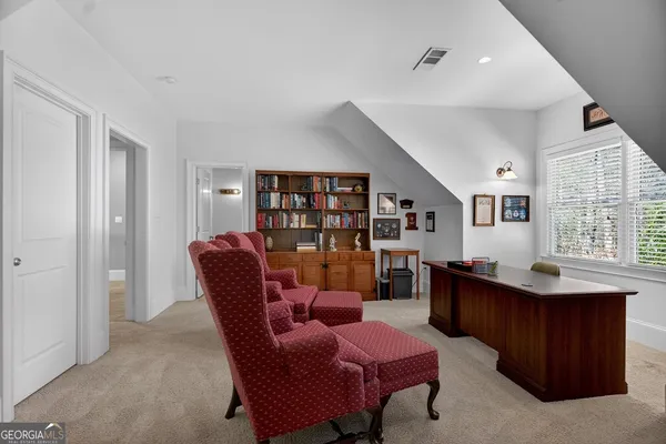 a dining room with furniture and window