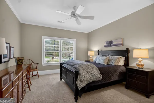 a bedroom with a bed and a table in it