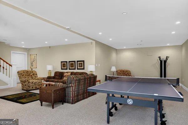 a view of a dinning room with furniture and wooden floor