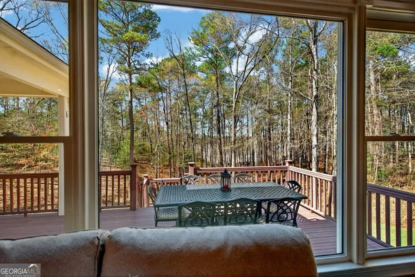 a view of a chairs and table on the deck