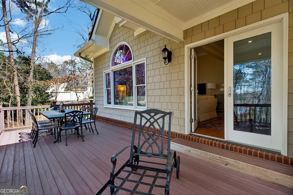 a view of a deck with a backyard