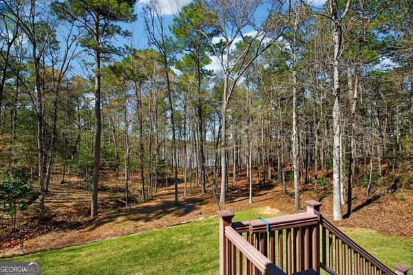 a view of outdoor space with wooden fence