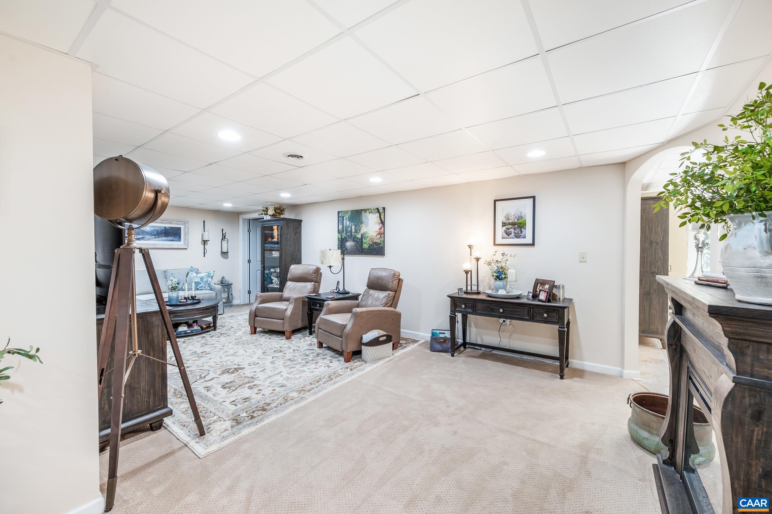 873 Copper Mine Road Dillwyn, VA 23936 - Photo 13 of 49 a living room with furniture and a chandelier