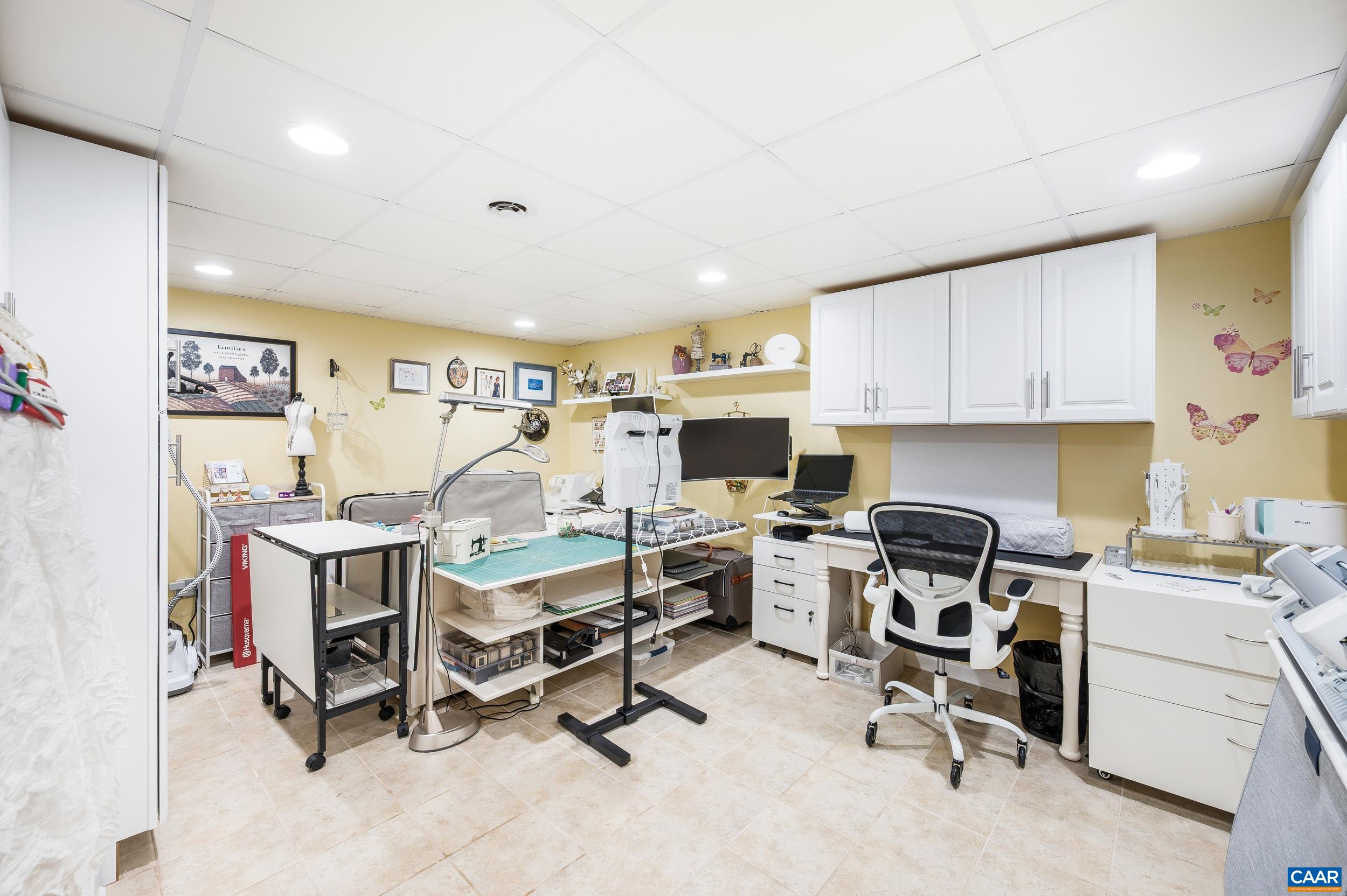 873 Copper Mine Road Dillwyn, VA 23936 - Photo 18 of 49 a view of a workspace with furniture and a window