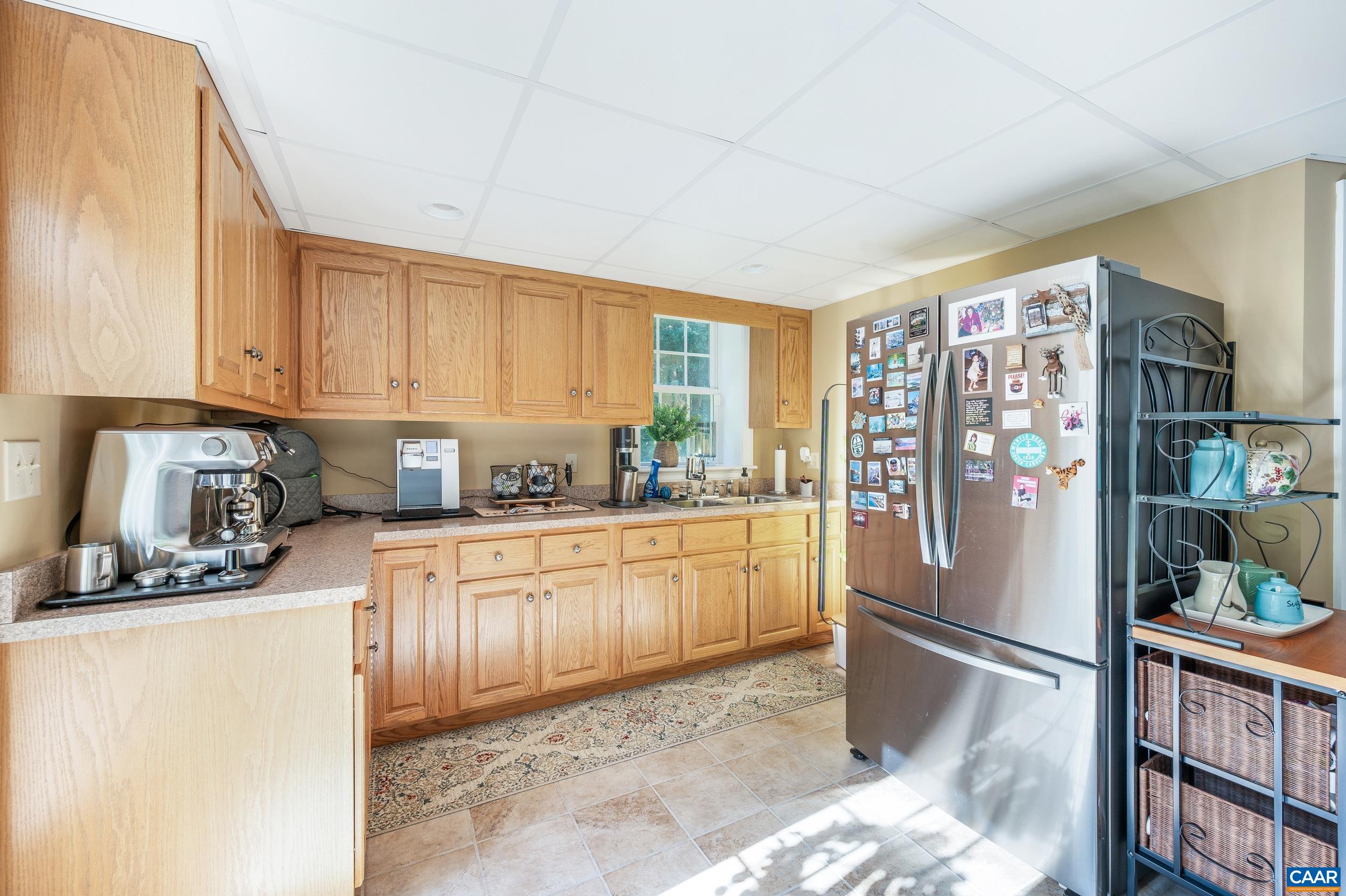 873 Copper Mine Road Dillwyn, VA 23936 - Photo 20 of 49 a kitchen with stainless steel appliances granite countertop a refrigerator sink and cabinets