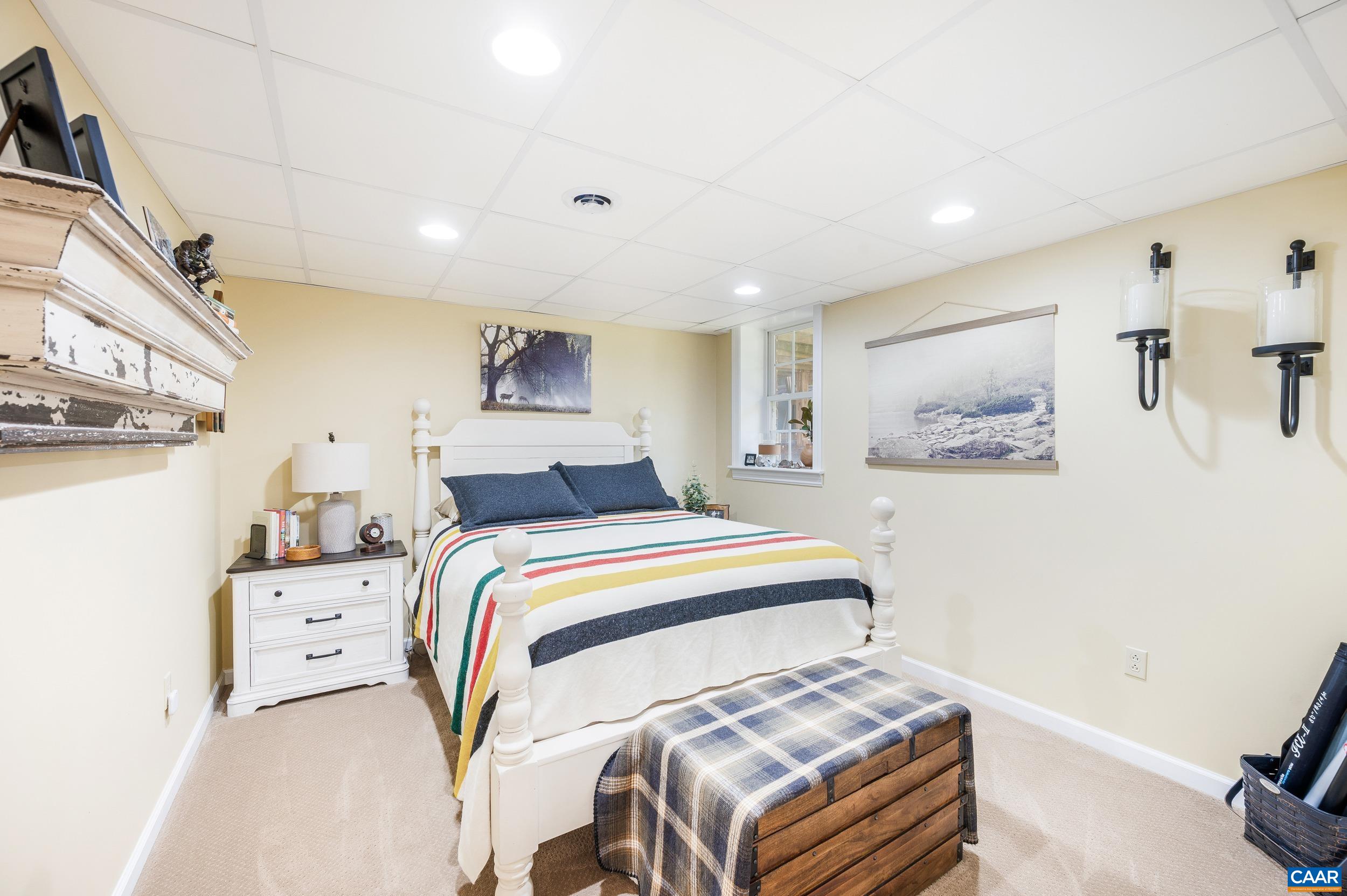 873 Copper Mine Road Dillwyn, VA 23936 - Photo 22 of 49 a bedroom with a bed and a painting on the wall