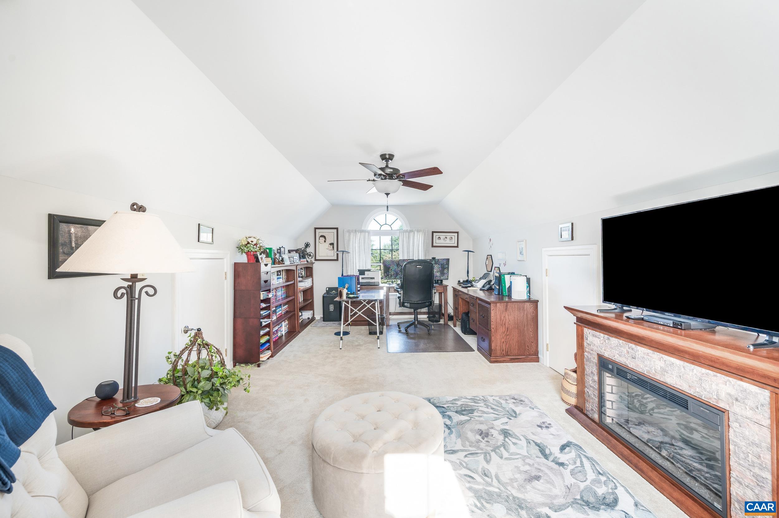 873 Copper Mine Road Dillwyn, VA 23936 - Photo 24 of 49 a living room with furniture and a flat screen tv