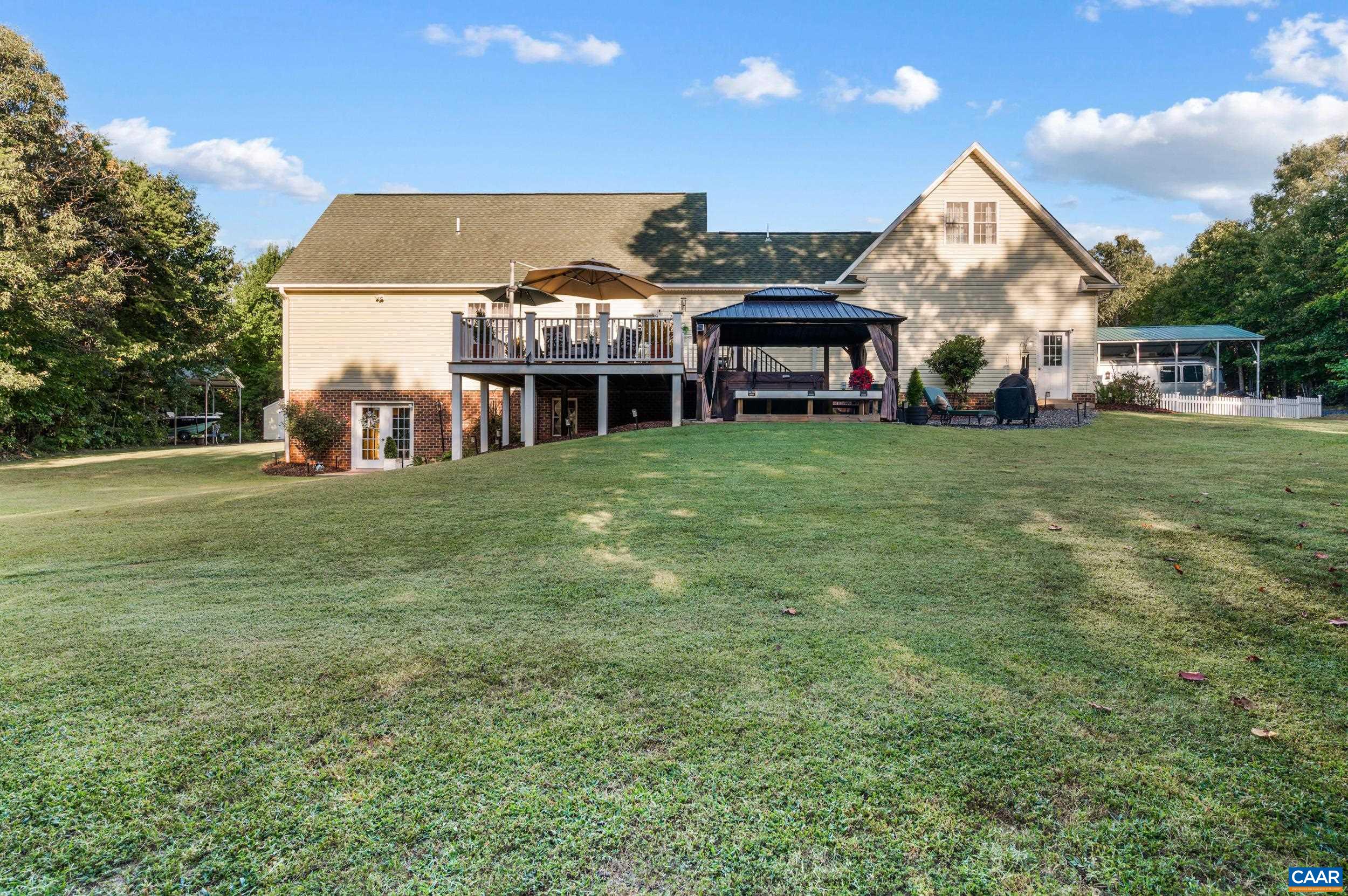 873 Copper Mine Road Dillwyn, VA 23936 - Photo 30 of 49 a view of a big house with a big yard and large trees