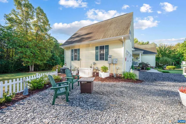 a view of a backyard with sitting area
