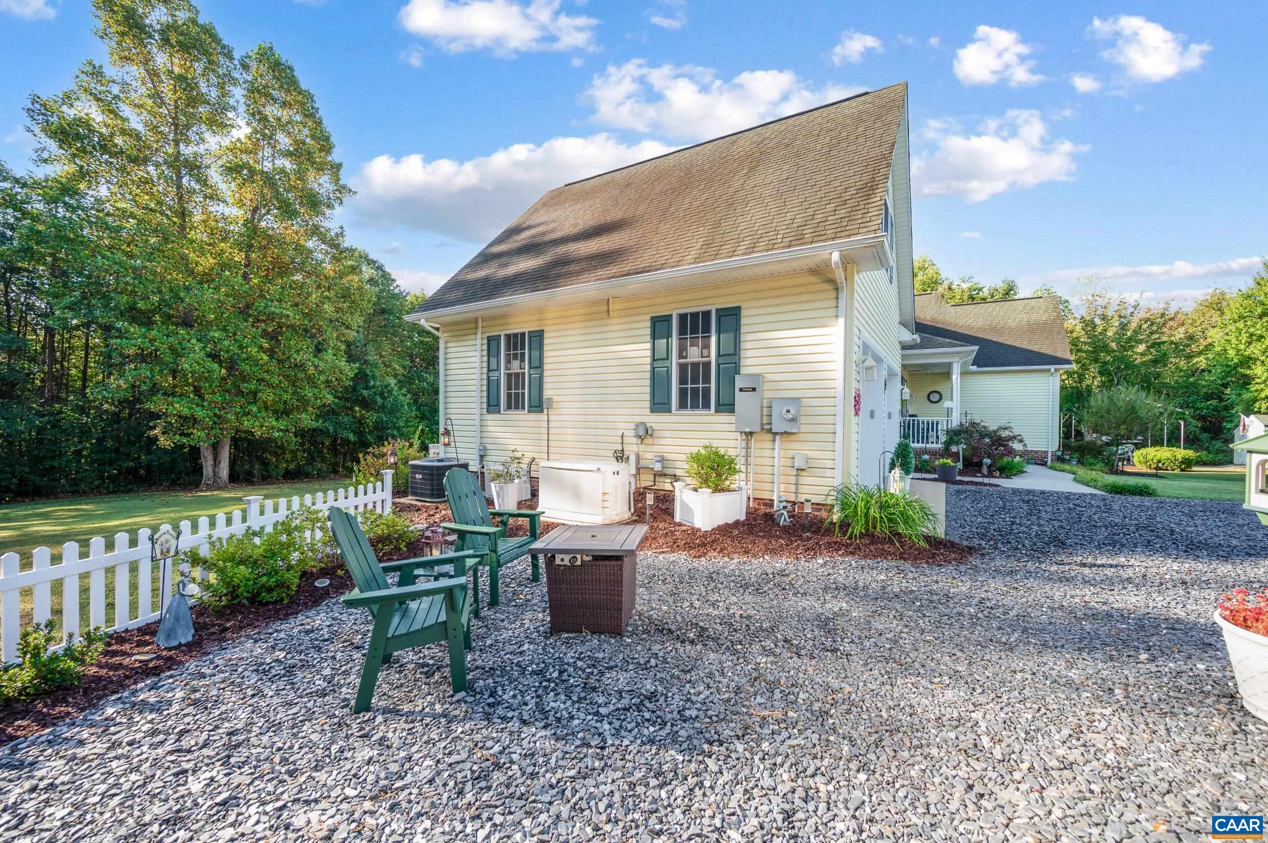 873 Copper Mine Road Dillwyn, VA 23936 - Photo 31 of 49 a view of a house with backyard sitting area and garden