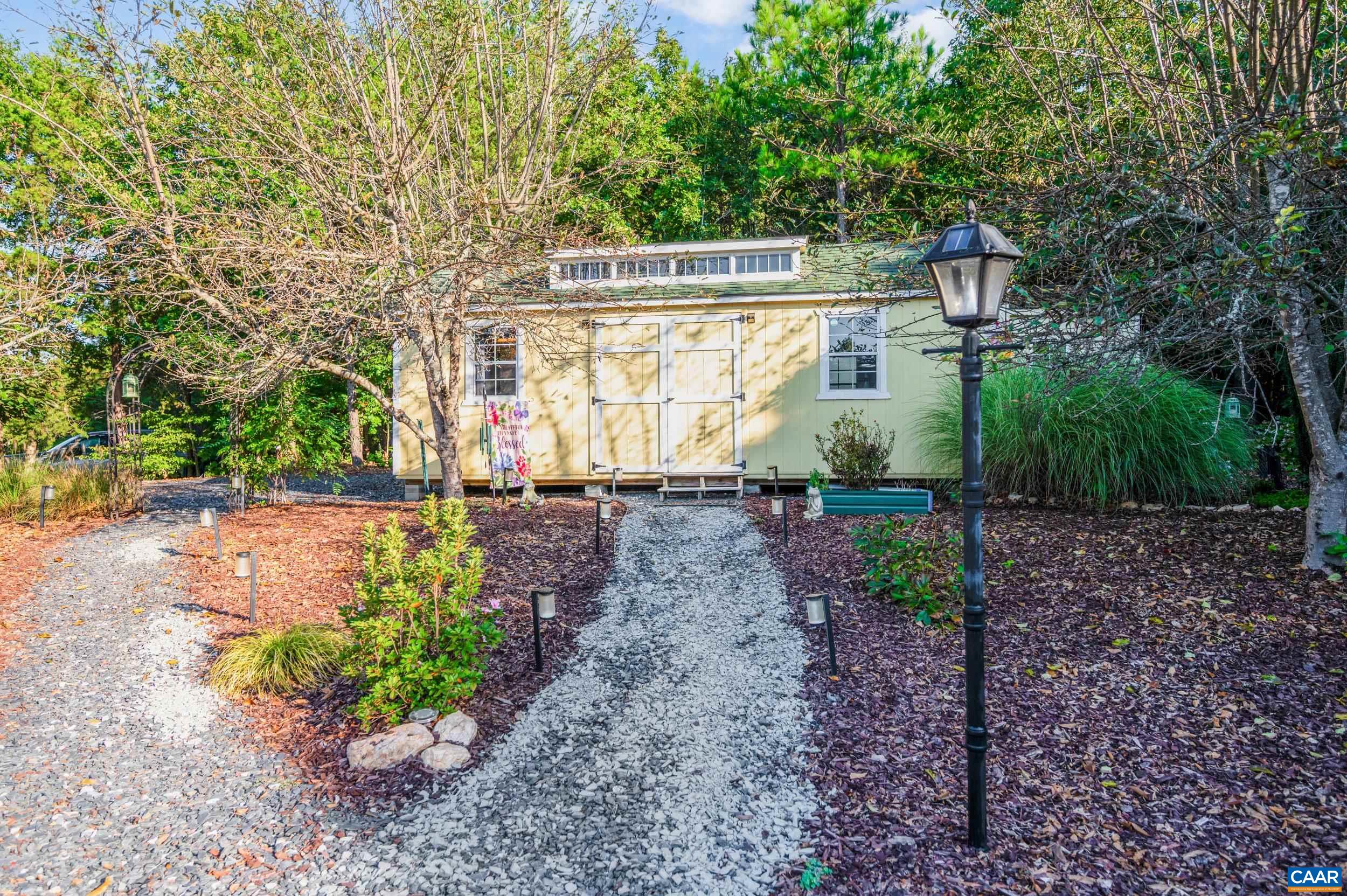 873 Copper Mine Road Dillwyn, VA 23936 - Photo 34 of 49 a front view of a house with garden