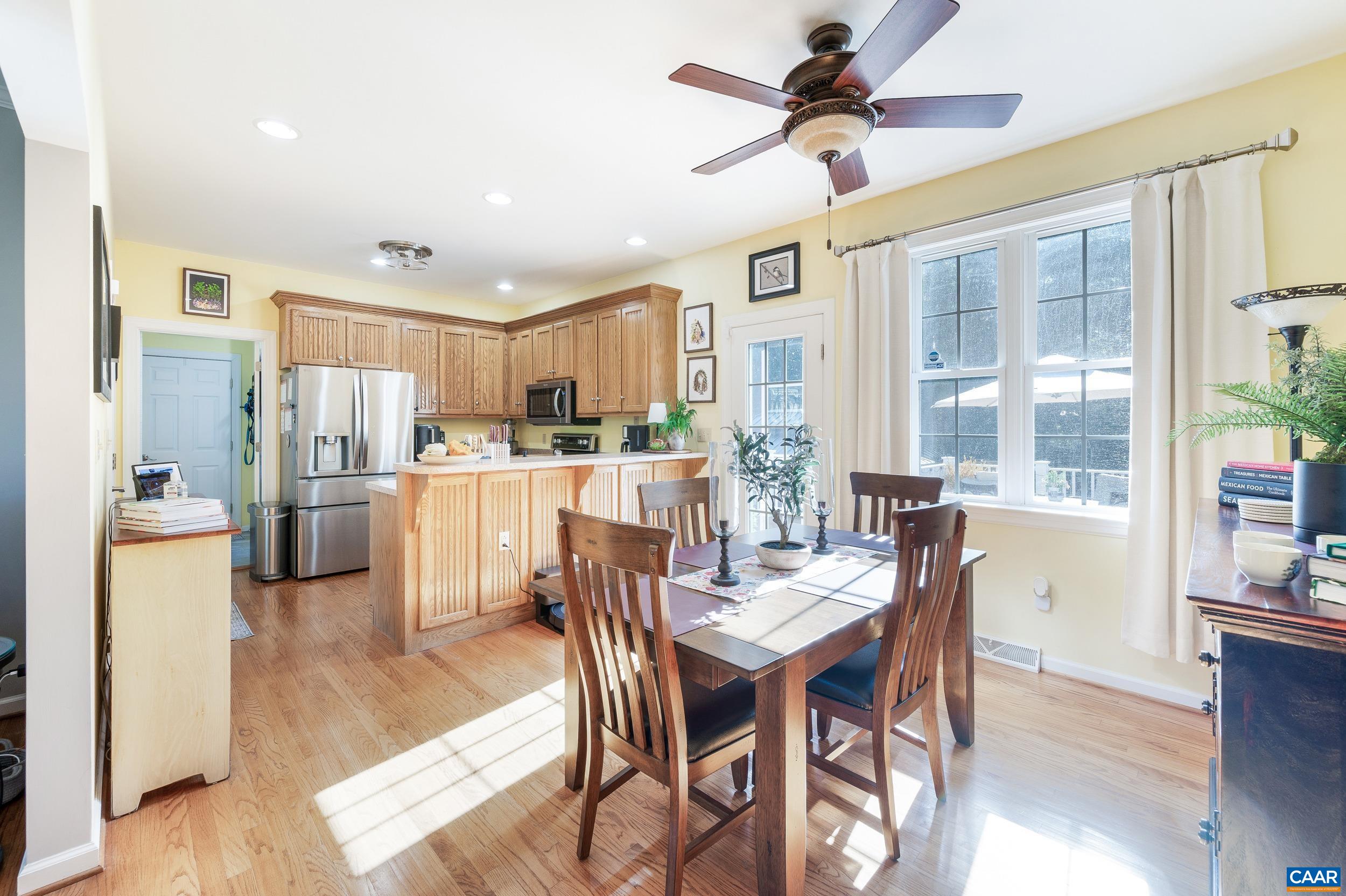 873 Copper Mine Road Dillwyn, VA 23936 - Photo 4 of 49 a dining room with furniture and a kitchen view