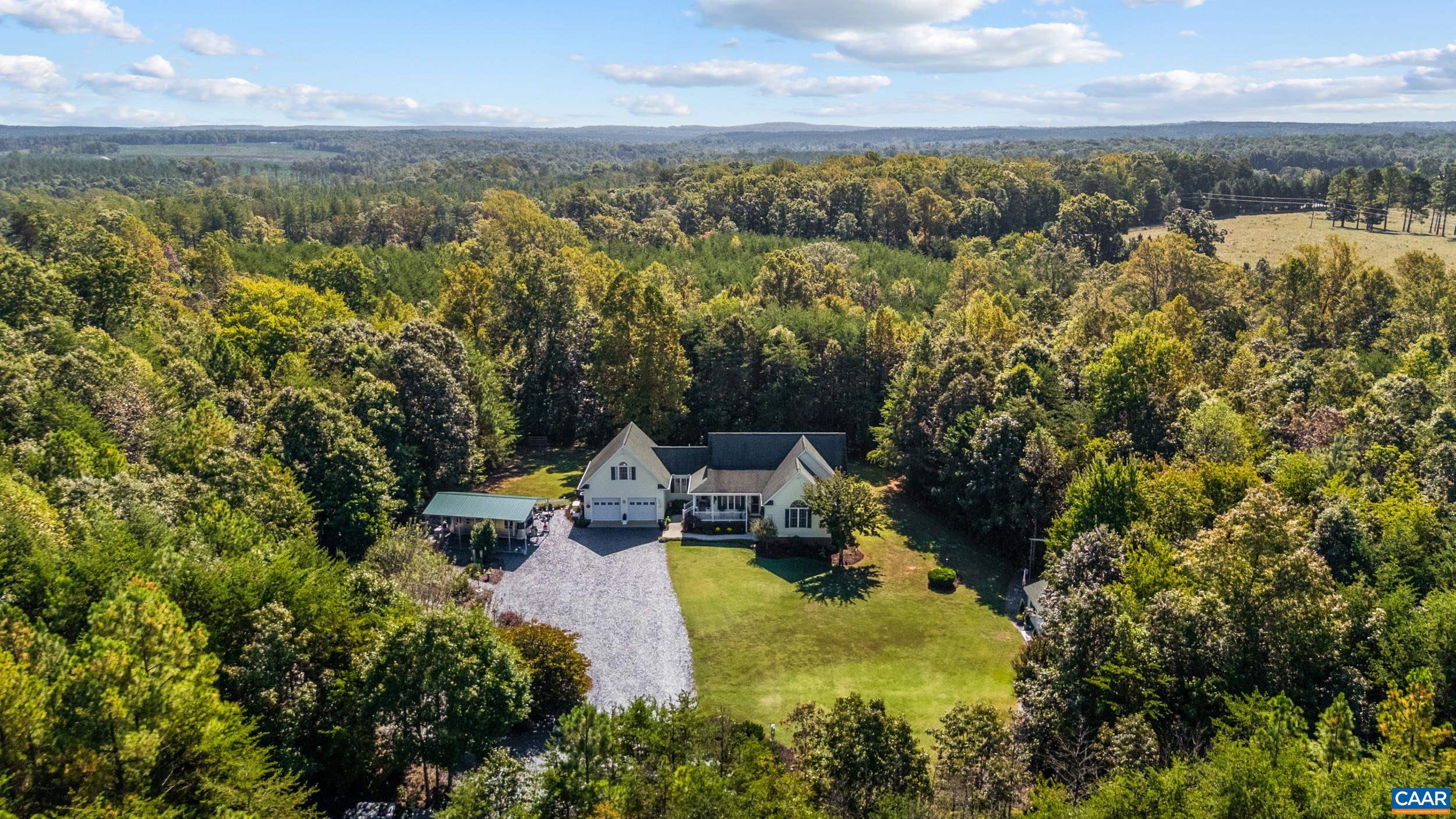 873 Copper Mine Road Dillwyn, VA 23936 - Photo 41 of 49 a view of a lake with houses in the back