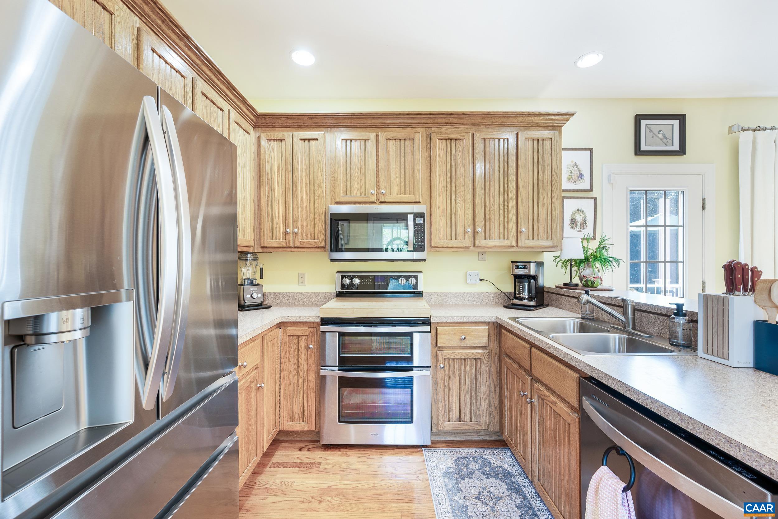 873 Copper Mine Road Dillwyn, VA 23936 - Photo 5 of 49 a kitchen with a refrigerator stove and sink