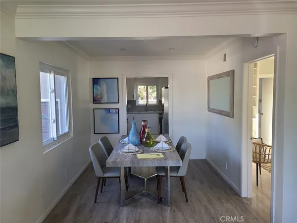 a view of a dining room with furniture and window