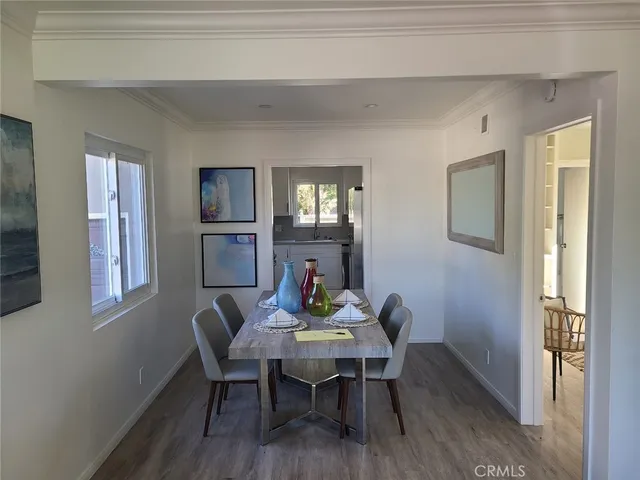 a view of a dining room with furniture and window