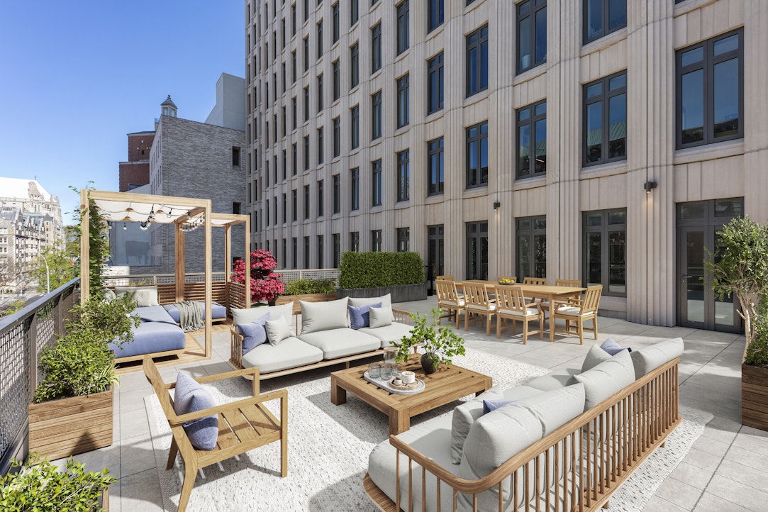 a view of a patio with couches table and chairs and potted plants
