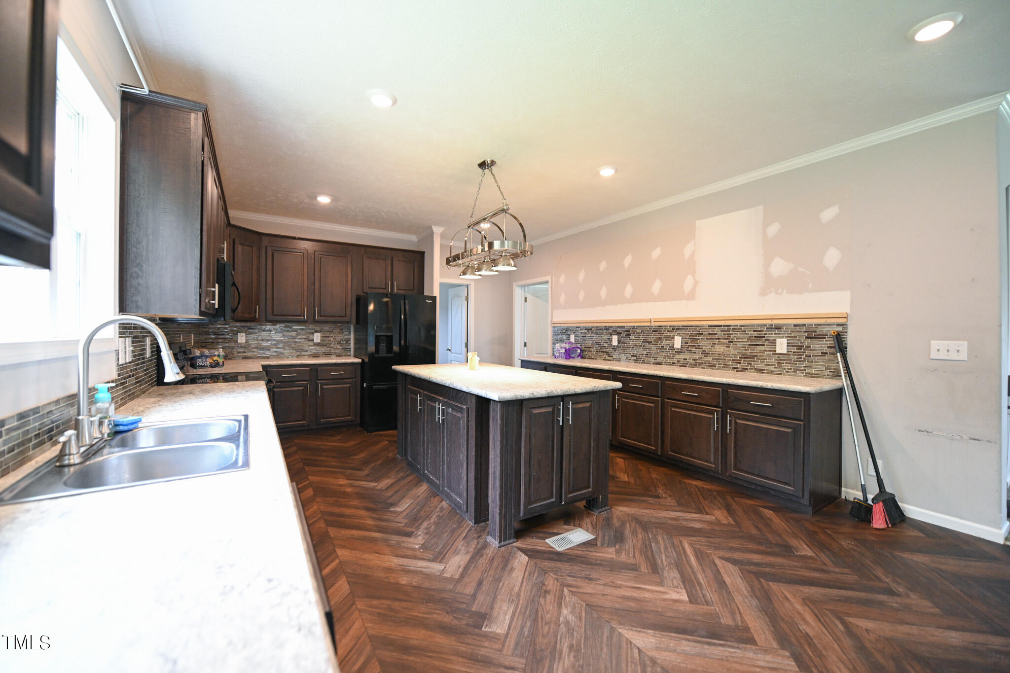 124 Evans Road Princeton, NC 27569 - Photo 14 of 44 a kitchen with kitchen island granite countertop a sink dishwasher stove and oven with cabinets