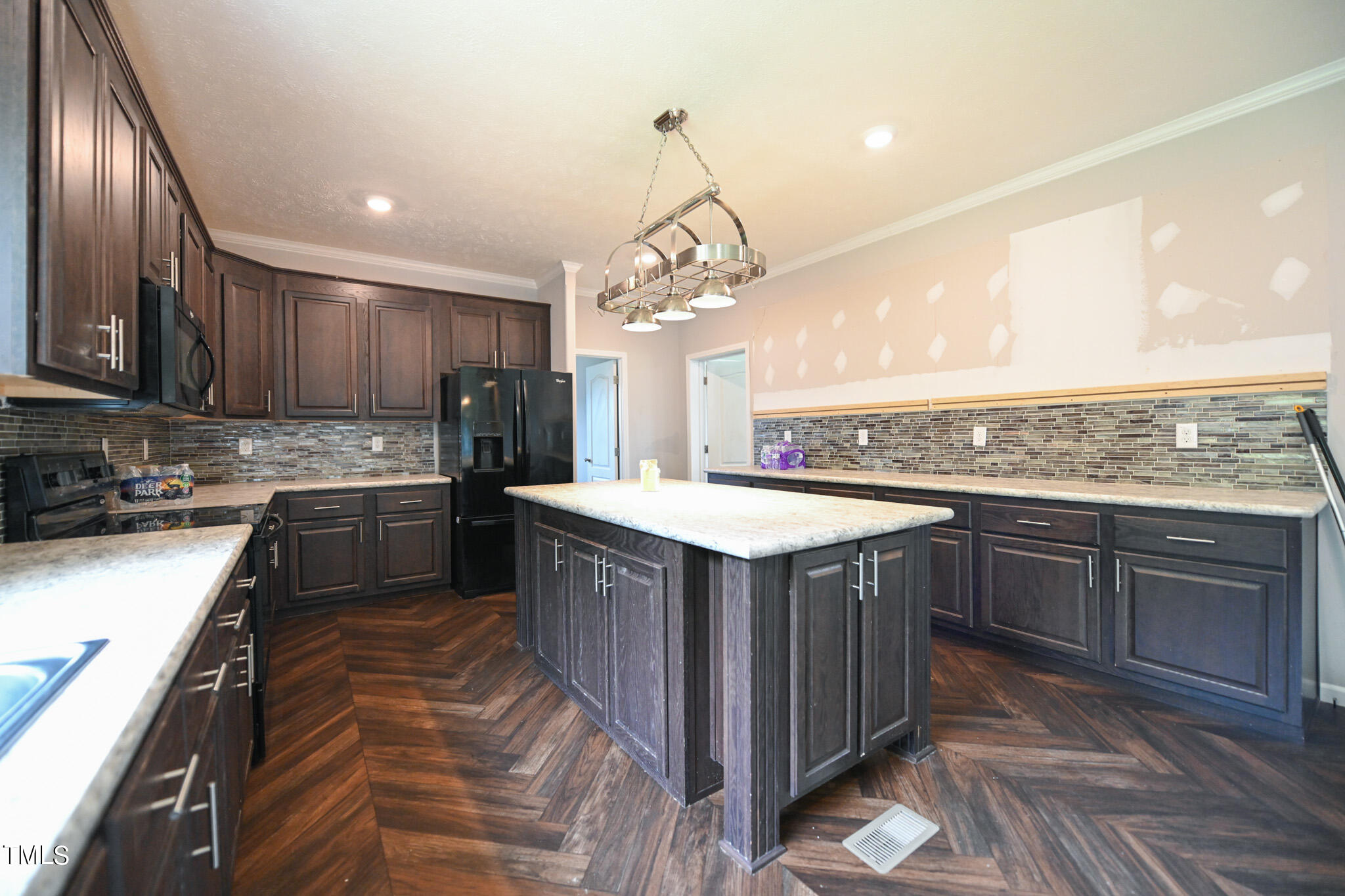 124 Evans Road Princeton, NC 27569 - Photo 15 of 44 a kitchen with a sink stove and cabinets