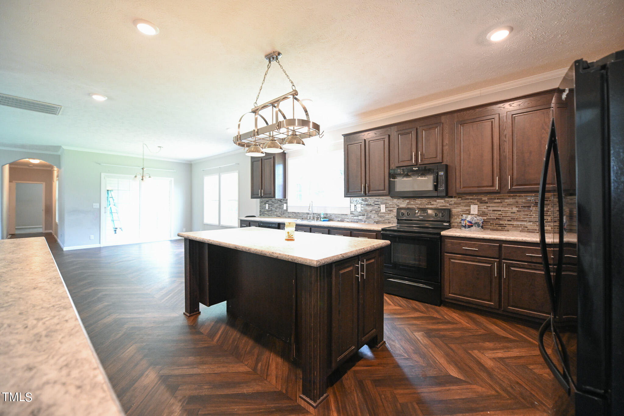 124 Evans Road Princeton, NC 27569 - Photo 17 of 44 a kitchen with stainless steel appliances granite countertop a sink a stove and a refrigerator
