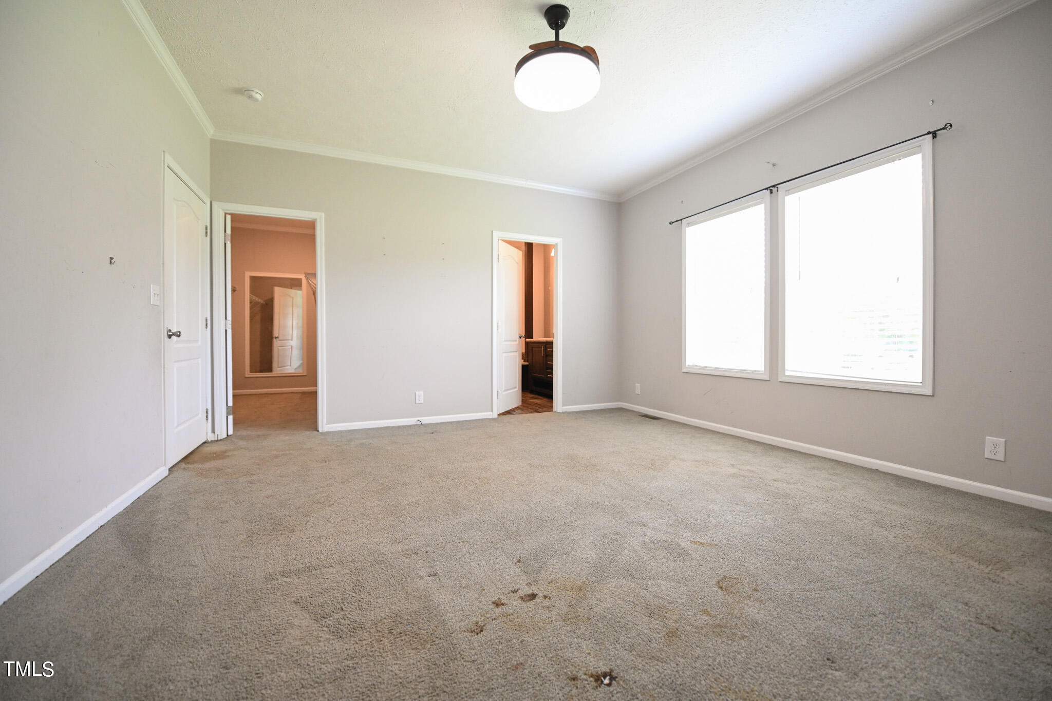 124 Evans Road Princeton, NC 27569 - Photo 21 of 44 an empty room with windows and ceiling fan