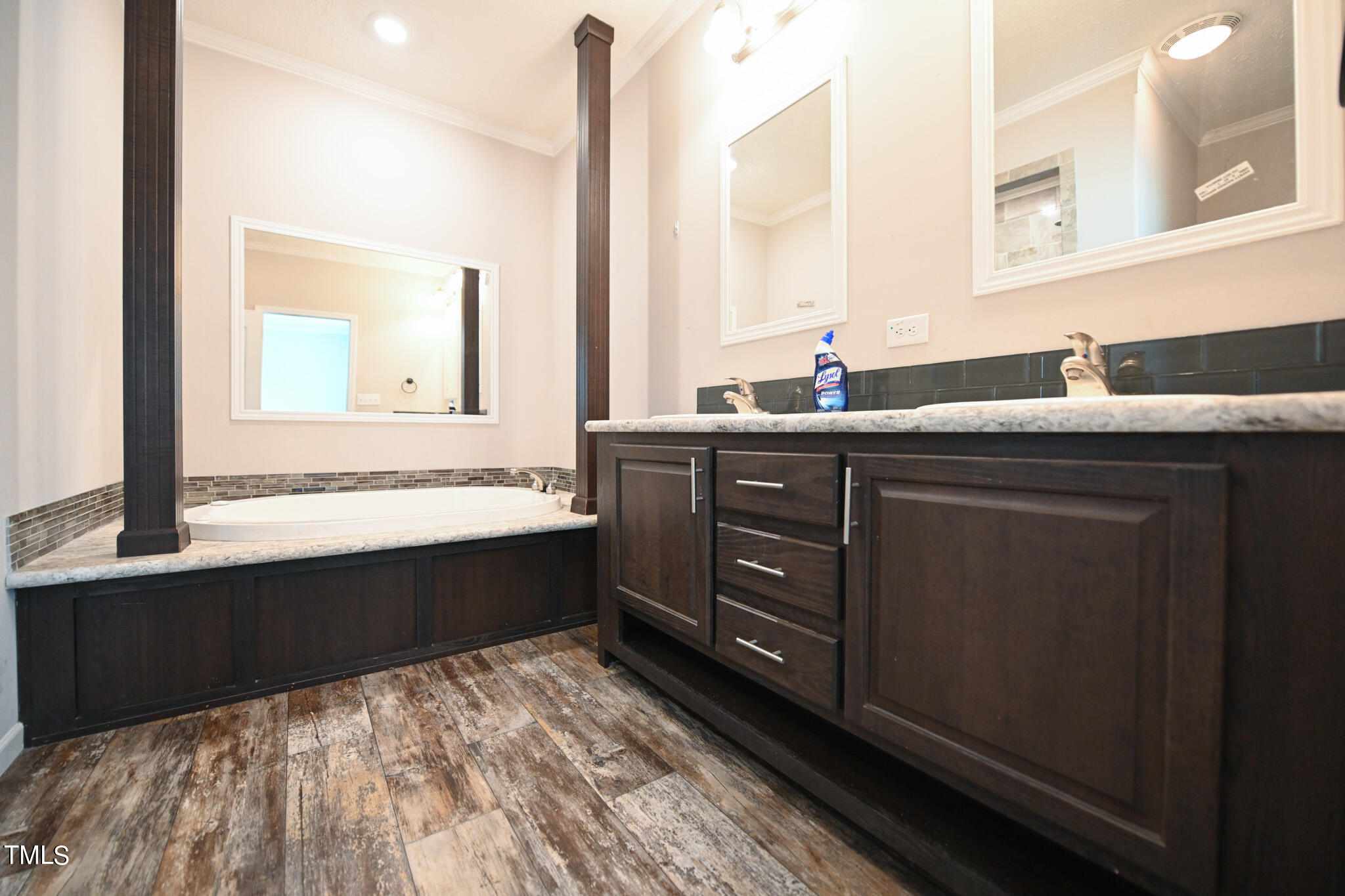 124 Evans Road Princeton, NC 27569 - Photo 23 of 44 a spacious bathroom with a sink and a mirror