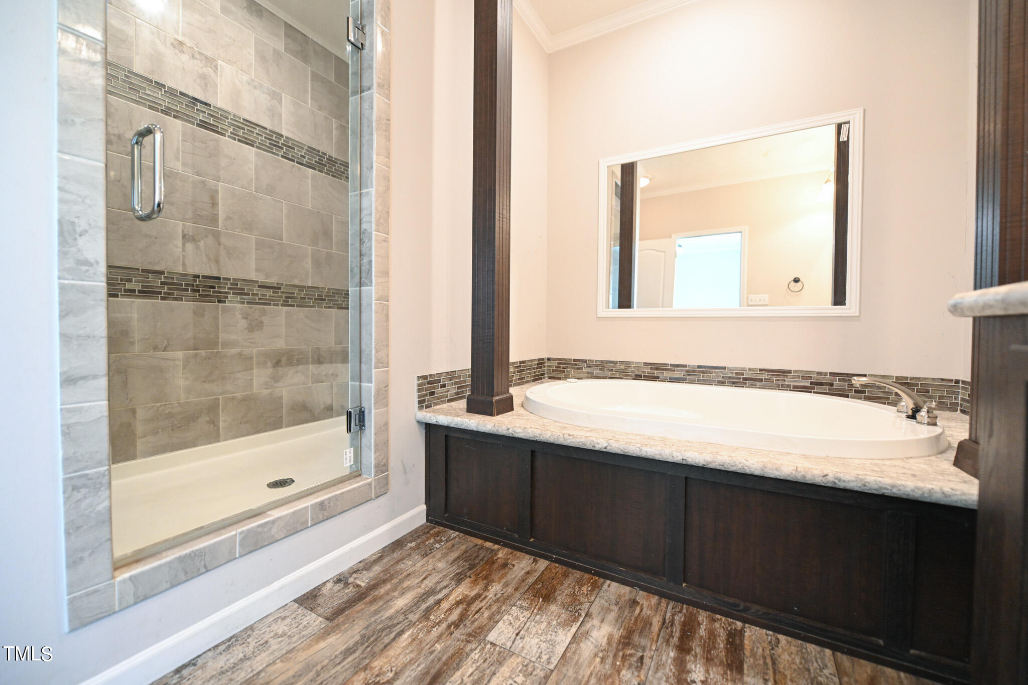 124 Evans Road Princeton, NC 27569 - Photo 24 of 44 a bathroom with a bathtub and a sink