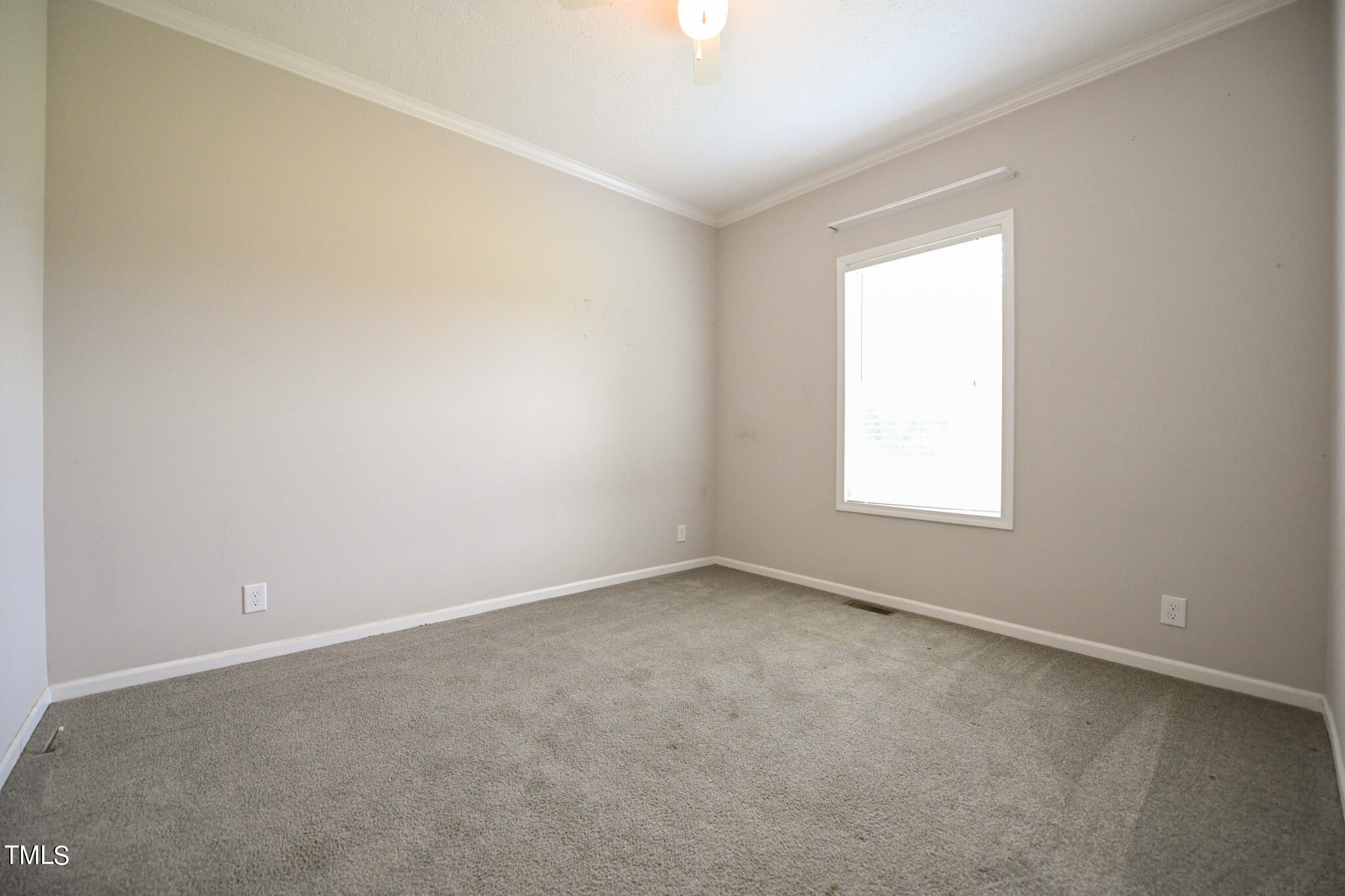 124 Evans Road Princeton, NC 27569 - Photo 27 of 44 an empty room with a window