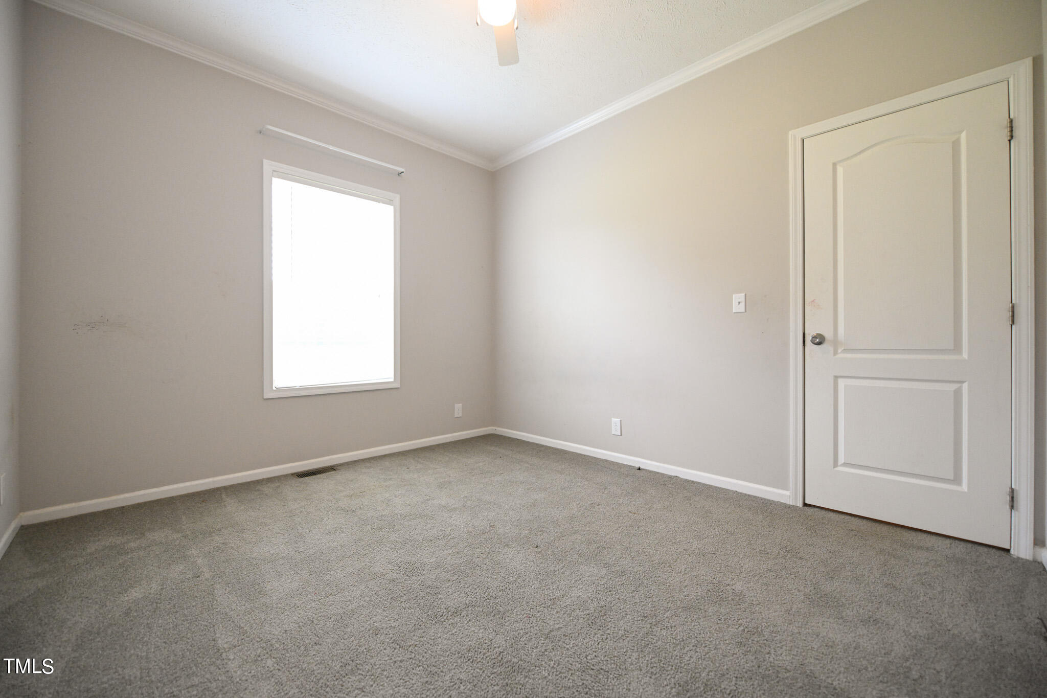124 Evans Road Princeton, NC 27569 - Photo 28 of 44 an empty room with windows