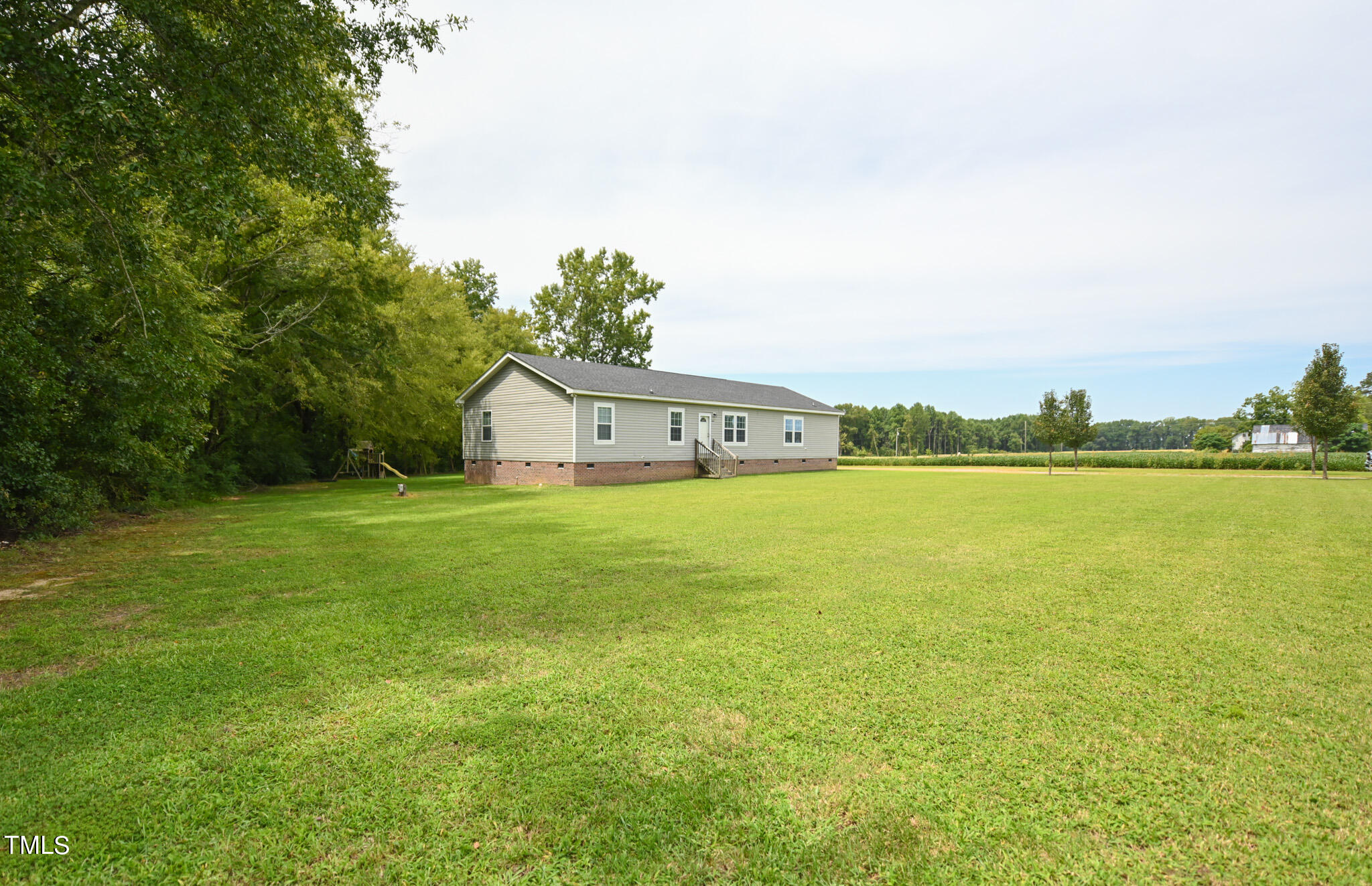 124 Evans Road Princeton, NC 27569 - Photo 3 of 44 a house view with a garden space