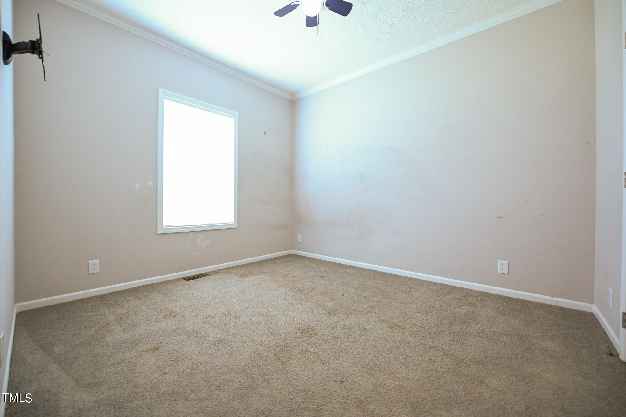 124 Evans Road Princeton, NC 27569 - Photo 31 of 44 an empty room with a window