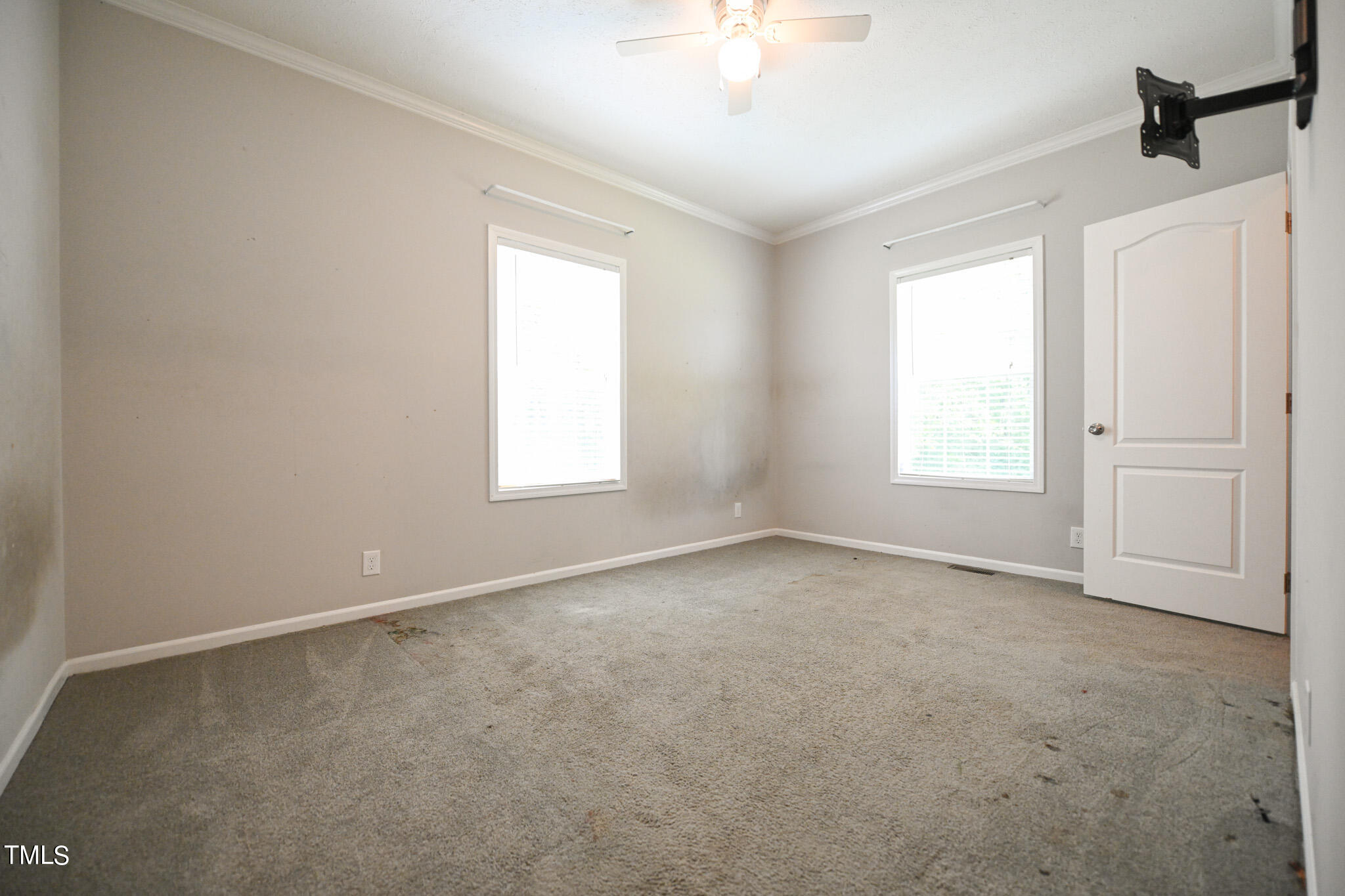 124 Evans Road Princeton, NC 27569 - Photo 34 of 44 an empty room with windows and fan