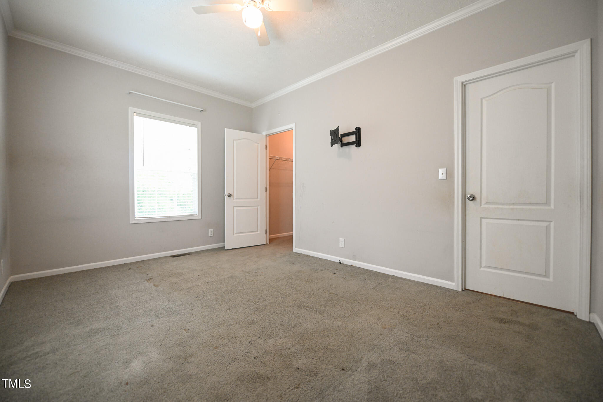 124 Evans Road Princeton, NC 27569 - Photo 35 of 44 an empty room with windows and closet