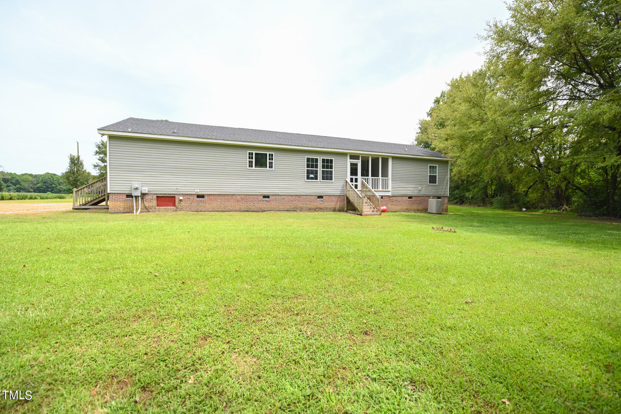 124 Evans Road Princeton, NC 27569 - Photo 38 of 44 a view of a house with a yard and sitting area