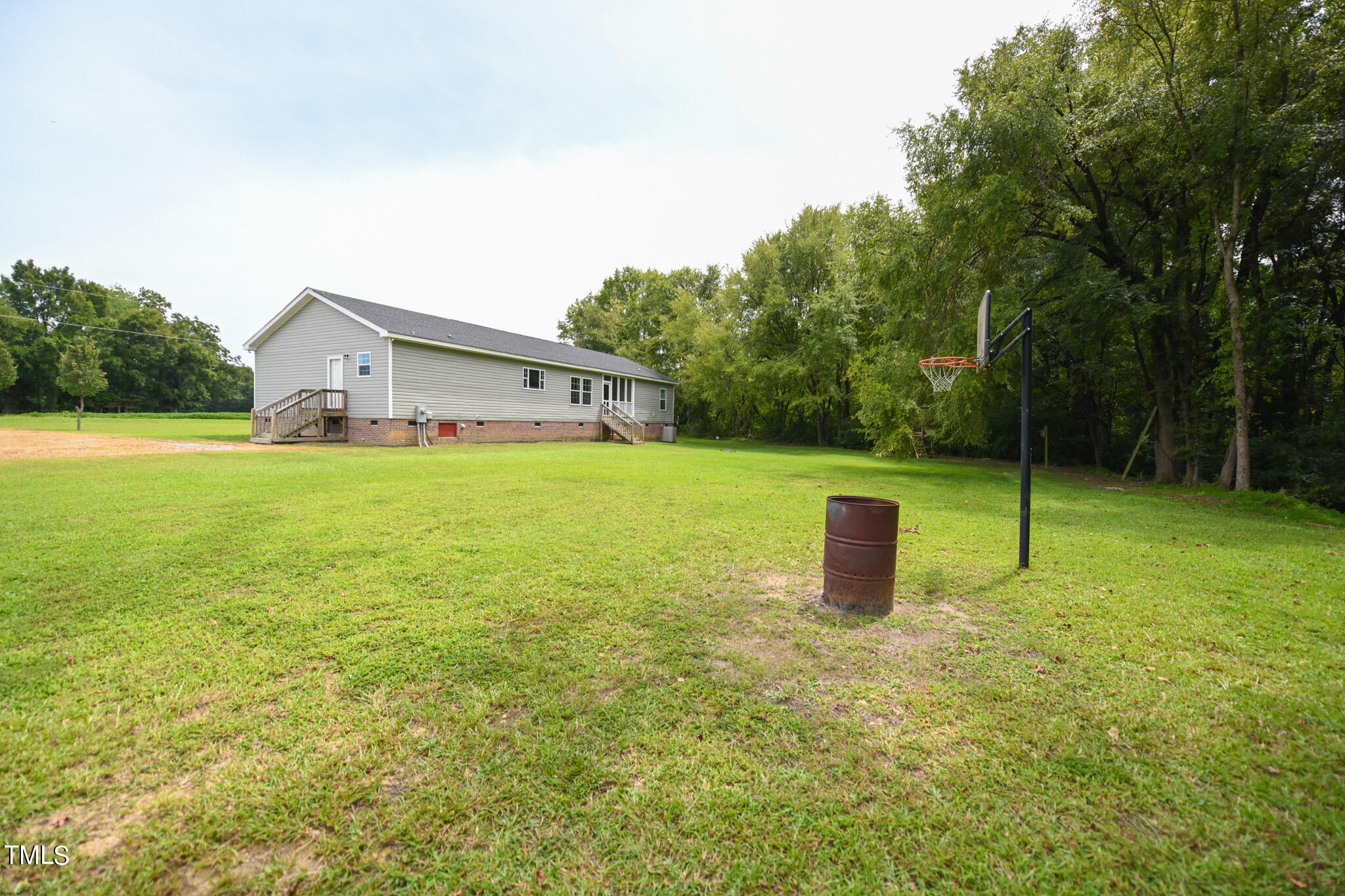 124 Evans Road Princeton, NC 27569 - Photo 43 of 44 a fire hydrant in the middle of a field