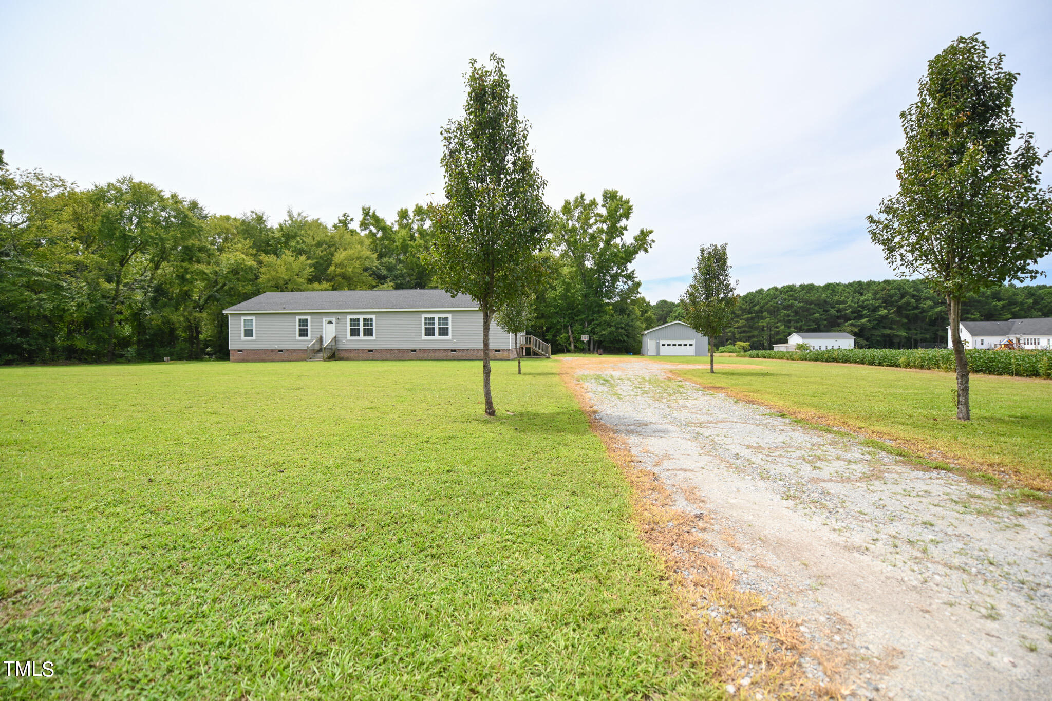 124 Evans Road Princeton, NC 27569 - Photo 44 of 44 a view of a swimming pool with a yard