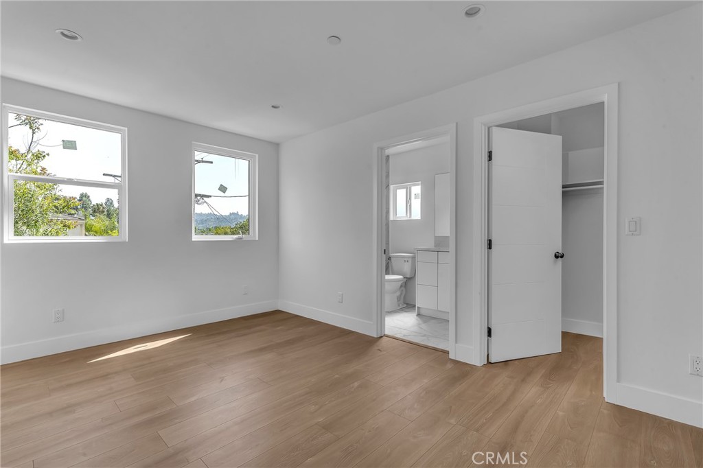 4453 Colfax Avenue, Unit 1 Studio City, CA 91602 - Photo 29 of 71 a view of an empty room with wooden floor and a window
