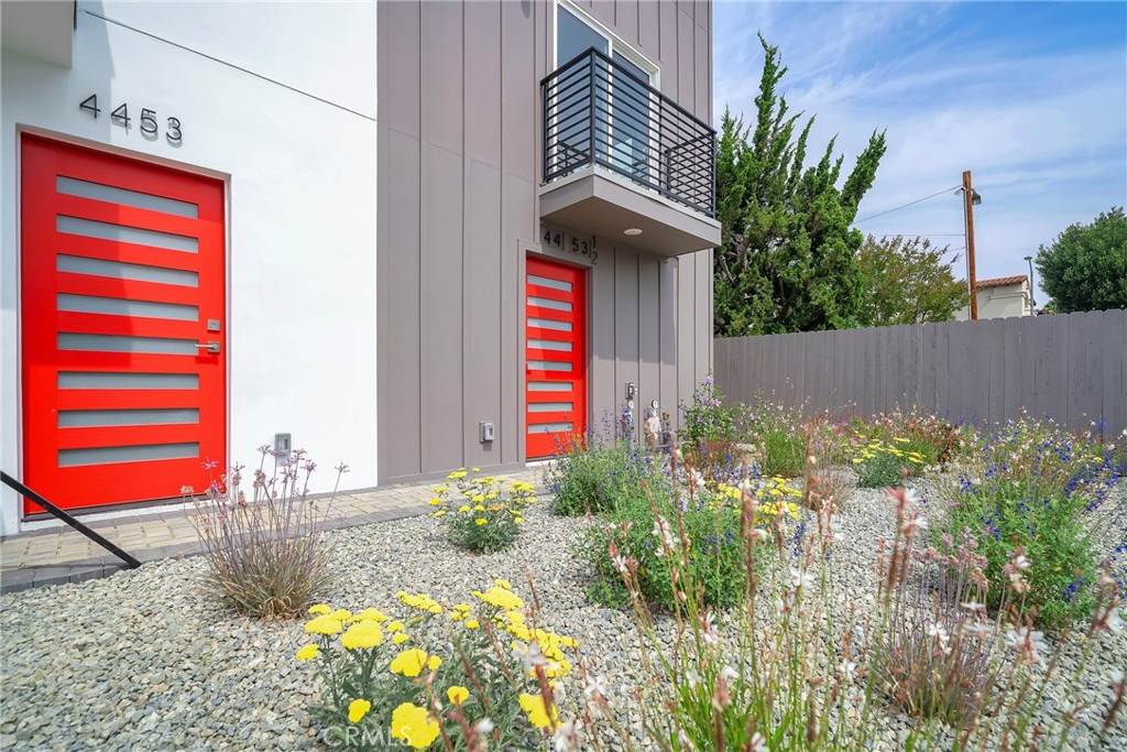 4453 Colfax Avenue, Unit 1 Studio City, CA 91602 - Photo 9 of 71 a front view of a house with a yard