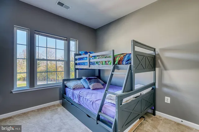 a bed room with a bed and a window