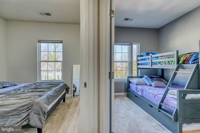 a bed room with a bed and a window