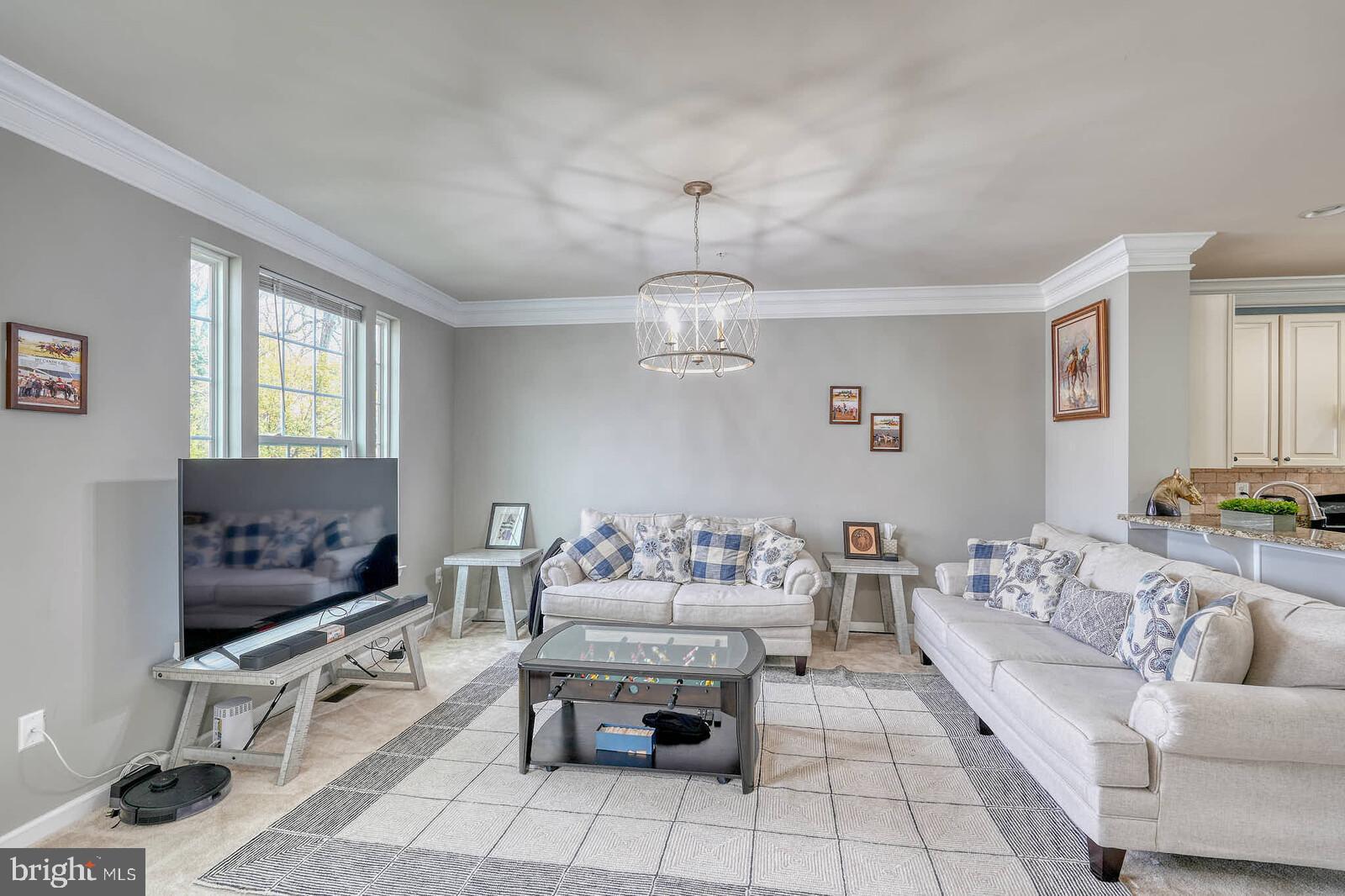 5183 Wyndholme Circle Baltimore, MD 21229 - Photo 2 of 31 a living room with furniture and a flat screen tv