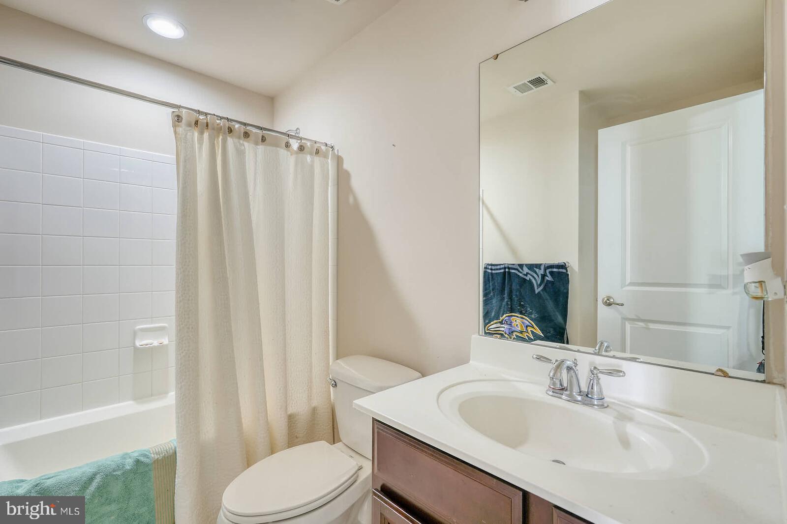 5183 Wyndholme Circle Baltimore, MD 21229 - Photo 21 of 31 a bathroom with a sink toilet and shower