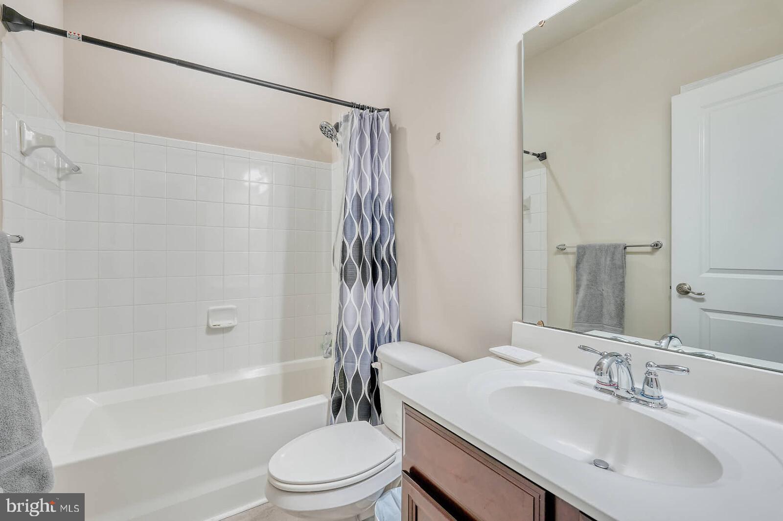 5183 Wyndholme Circle Baltimore, MD 21229 - Photo 22 of 31 a bathroom with a sink toilet and shower