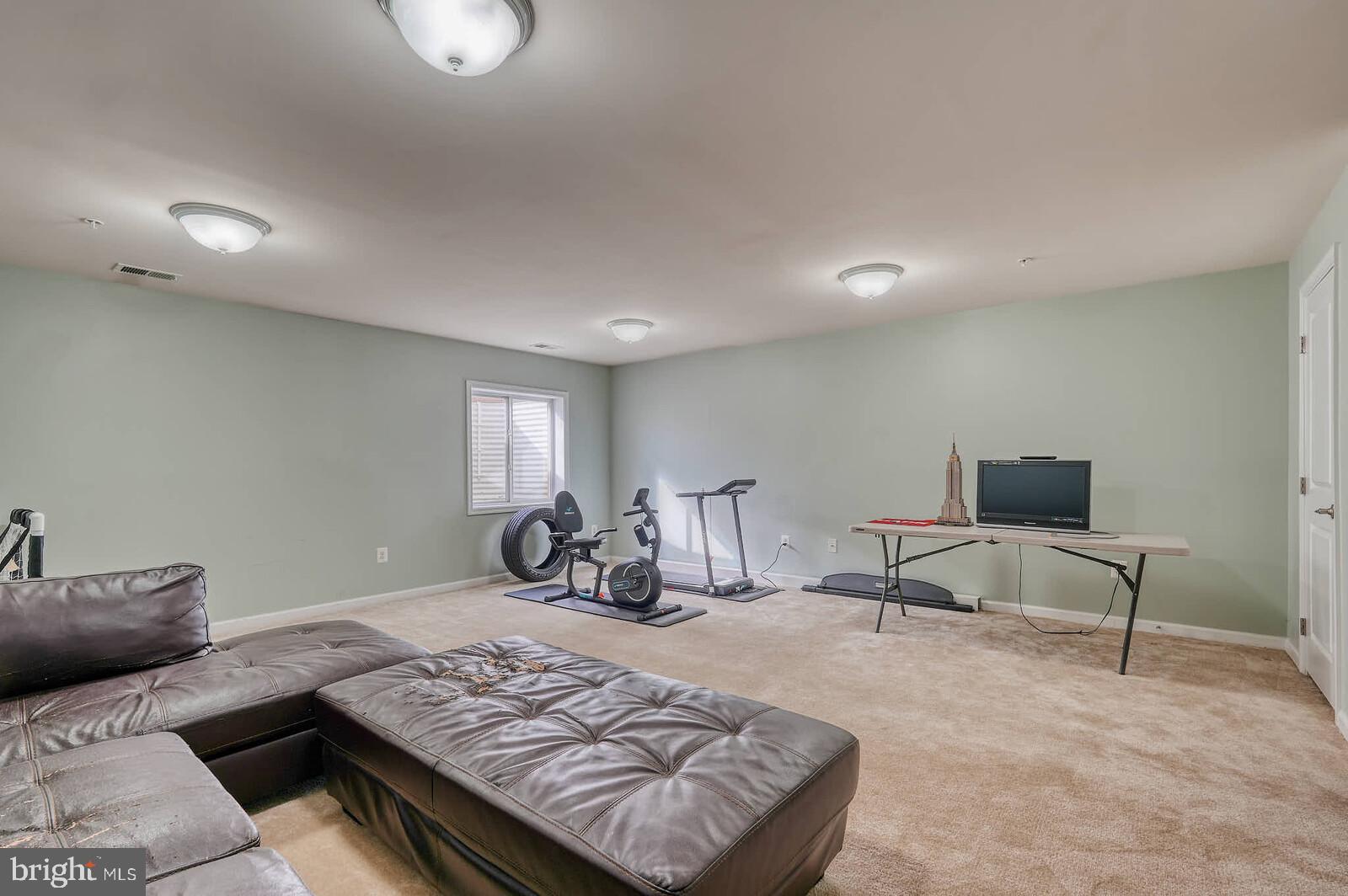 5183 Wyndholme Circle Baltimore, MD 21229 - Photo 24 of 31 a living room with furniture and a rug