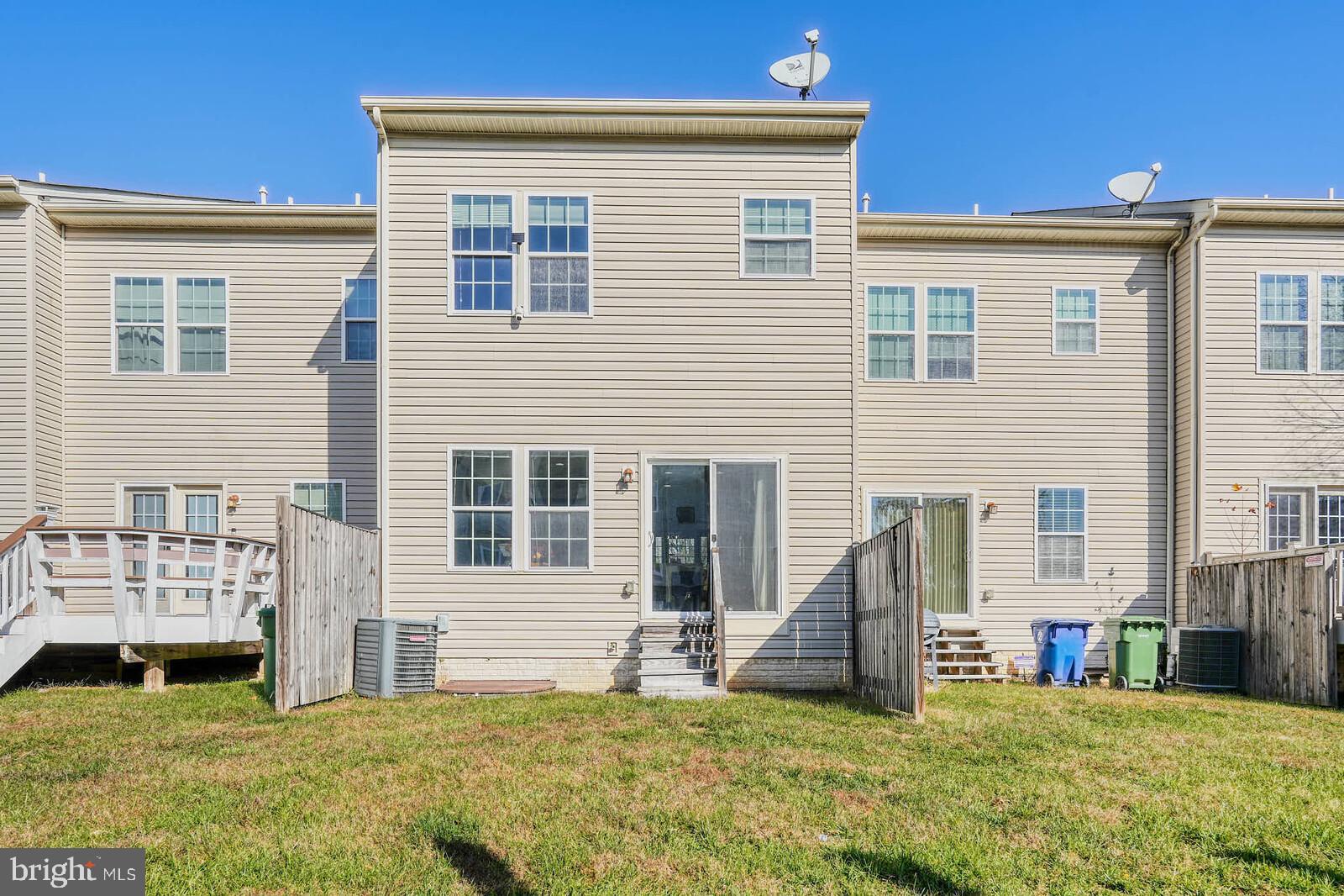 5183 Wyndholme Circle Baltimore, MD 21229 - Photo 28 of 31 a view of a house with a yard and porch